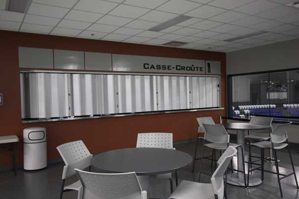 Accordion-style counter door installed on a restaurant serving window