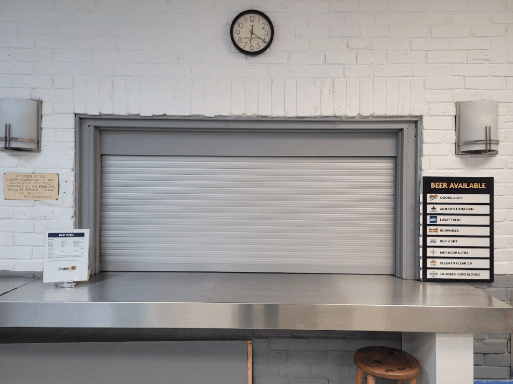 Roll-up security shutter on a bar counter top serving area