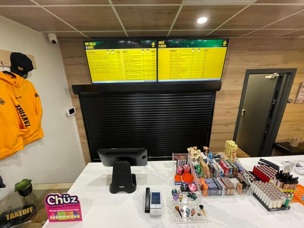 Roll-up counter shutters at a cannabis dispensary service window