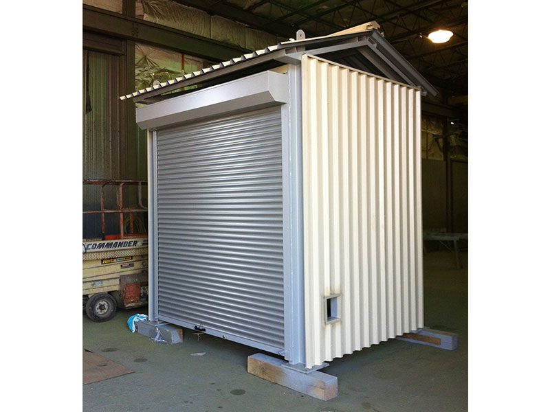 Metal roll-up shutter secured on a commercial kiosk