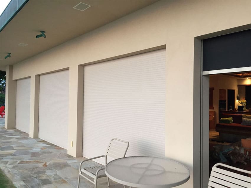 White aluminum roll-up garage door on a residential property