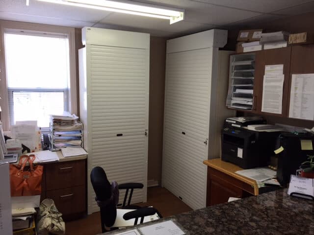 2 white cabinet security shutters